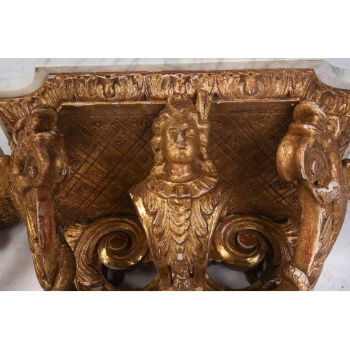 213 - A pair of carved wood and gilt gesso wall brackets with shaped marble tops, late 19th century/ early... 