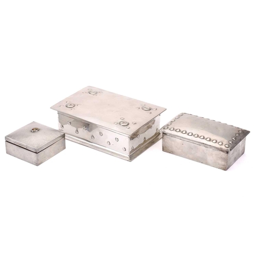 214 - A Liberty & Co of London Tudric rectangular wrought pewter cigarette box, the hinged top embossed wi... 