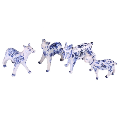 226 - A group of four Dutch delft animals, Late 18th/ early 19th century, modelled as three cows and a goa... 