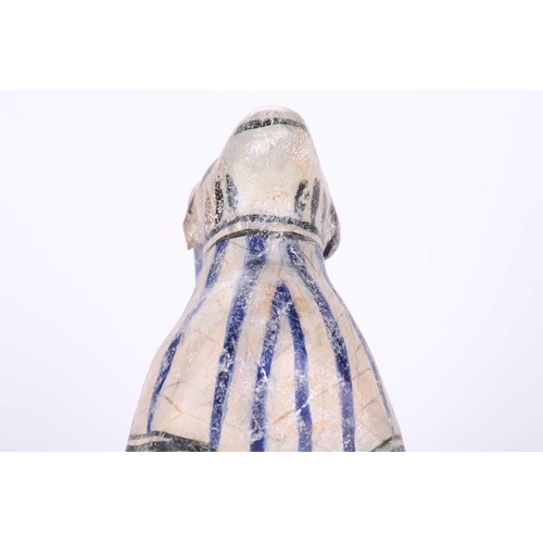 231 - An Islamic pottery ram, probably Iran, the cylindrical body decorated with bands of black and blue, ... 