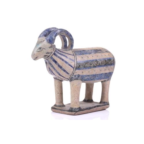 231 - An Islamic pottery ram, probably Iran, the cylindrical body decorated with bands of black and blue, ... 