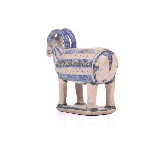 231 - An Islamic pottery ram, probably Iran, the cylindrical body decorated with bands of black and blue, ... 