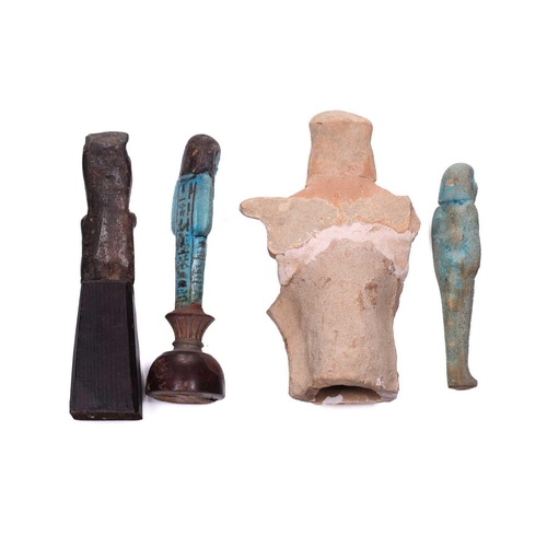 233 - An Egyptian basalt-type Shabti with a hieroglyphic panel to the torso mounted in an old museum-type ... 