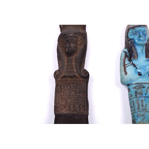 233 - An Egyptian basalt-type Shabti with a hieroglyphic panel to the torso mounted in an old museum-type ... 