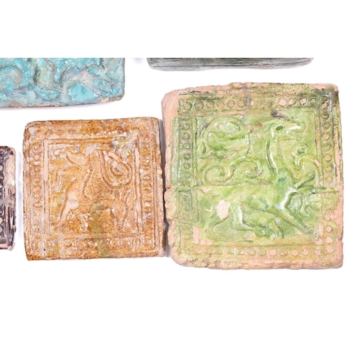 238 - A group of eight various Islamic tiles, 13th century and later, including a large turquoise glazed f... 