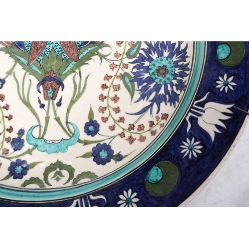 245 - A Torquato Castellani Faience Charger, with blue and turquoise Iznik style floral design, within a b... 