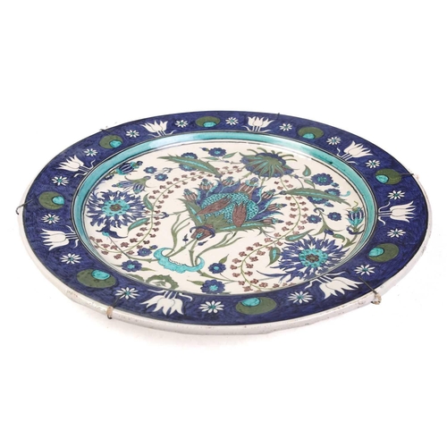 245 - A Torquato Castellani Faience Charger, with blue and turquoise Iznik style floral design, within a b... 