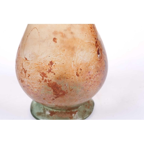 257 - A Roman glass inverted baluster form flask with trail decorated neck, bearing an old handwritten col... 