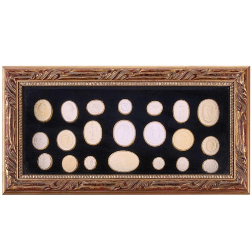 273 - A collection of Grand Tour plaster intaglios, each numbered, contained in two glazed box frames, 20 ... 