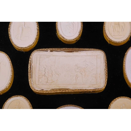 273 - A collection of Grand Tour plaster intaglios, each numbered, contained in two glazed box frames, 20 ... 