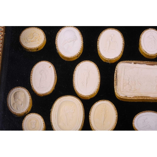 273 - A collection of Grand Tour plaster intaglios, each numbered, contained in two glazed box frames, 20 ... 