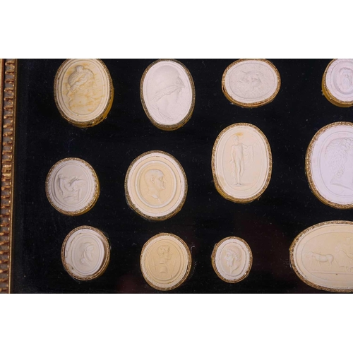 273 - A collection of Grand Tour plaster intaglios, each numbered, contained in two glazed box frames, 20 ... 