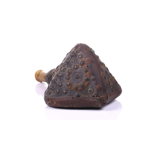 274 - A North African triangular section powder flask 18th/19th century, with studded hide body and turned... 