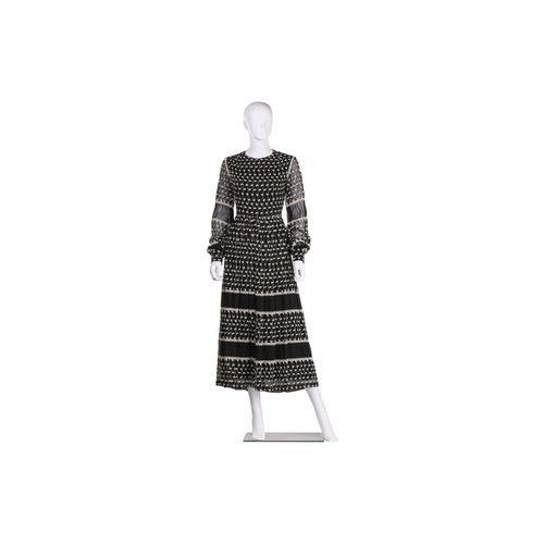 103 - Christian Dior; a black and embroidered long dress, with long sleeves and high neckline, 'Boutique' ... 