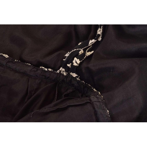 103 - Christian Dior; a black and embroidered long dress, with long sleeves and high neckline, 'Boutique' ... 