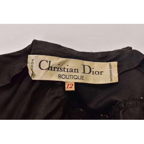 103 - Christian Dior; a black and embroidered long dress, with long sleeves and high neckline, 'Boutique' ... 