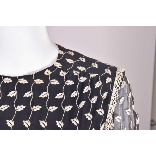103 - Christian Dior; a black and embroidered long dress, with long sleeves and high neckline, 'Boutique' ... 
