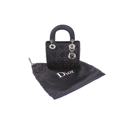 47 - Christian Dior - a mini Lady Dior evening bag in black satin, circa 2007, embellished with baguette-... 