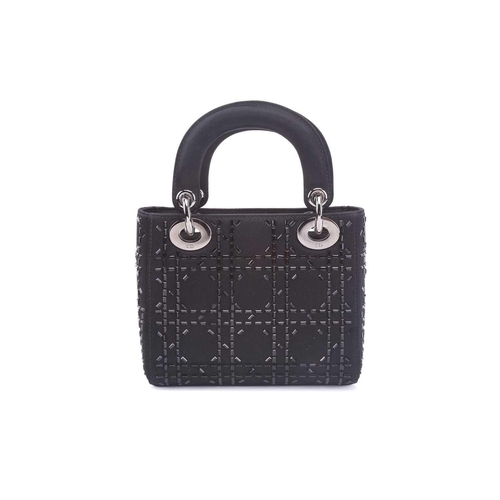 47 - Christian Dior - a mini Lady Dior evening bag in black satin, circa 2007, embellished with baguette-... 