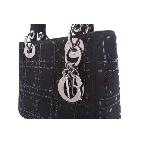 47 - Christian Dior - a mini Lady Dior evening bag in black satin, circa 2007, embellished with baguette-... 