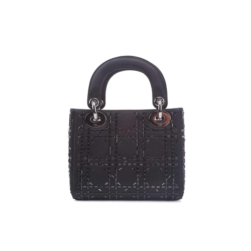 47 - Christian Dior - a mini Lady Dior evening bag in black satin, circa 2007, embellished with baguette-... 