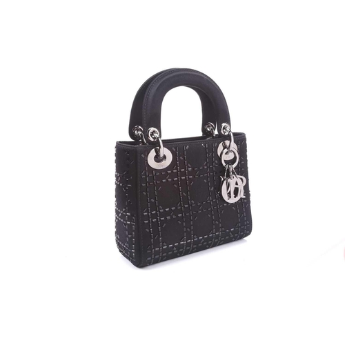 47 - Christian Dior - a mini Lady Dior evening bag in black satin, circa 2007, embellished with baguette-... 