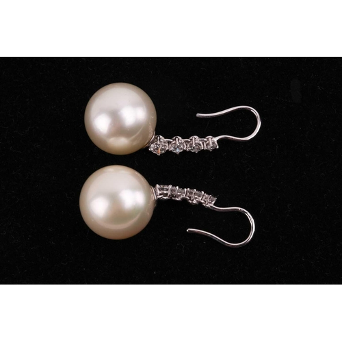 101 - A pair of South Sea pearl and diamond earrings, each pearl 16-16.3mm in diameter, suspended from a r... 