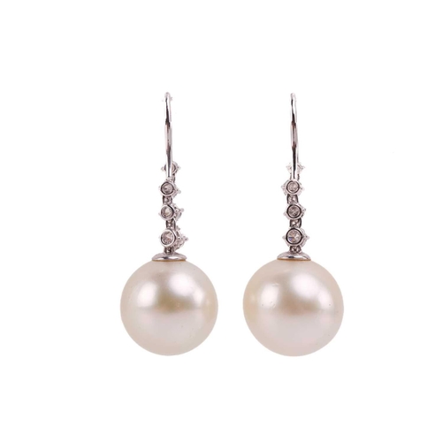 101 - A pair of South Sea pearl and diamond earrings, each pearl 16-16.3mm in diameter, suspended from a r... 