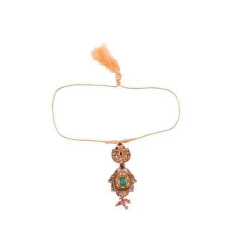 104 - An Indian polychromatic gem-set necklace and earrings ensuite; the pendant with a cream-coloured ena... 