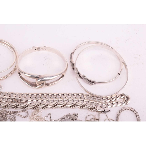 109 - A collection of assorted white metal jewellery including various bangles, bracelets necklace chains ... 