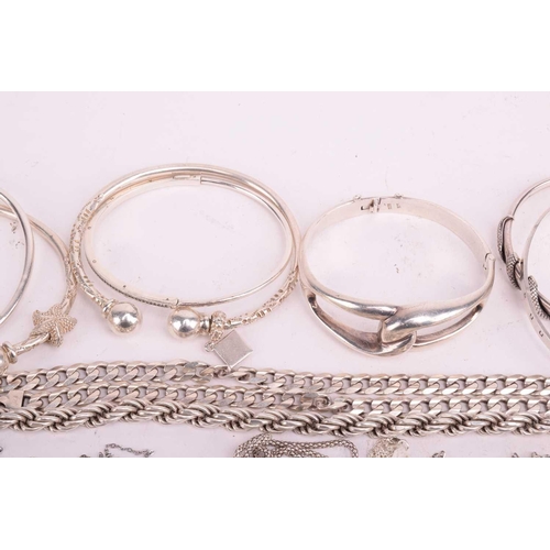 109 - A collection of assorted white metal jewellery including various bangles, bracelets necklace chains ... 