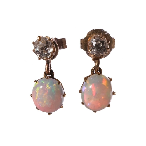 110 - A pair of diamond and opal drop earrings, each comprising an old-cut diamond surmount, approximately... 