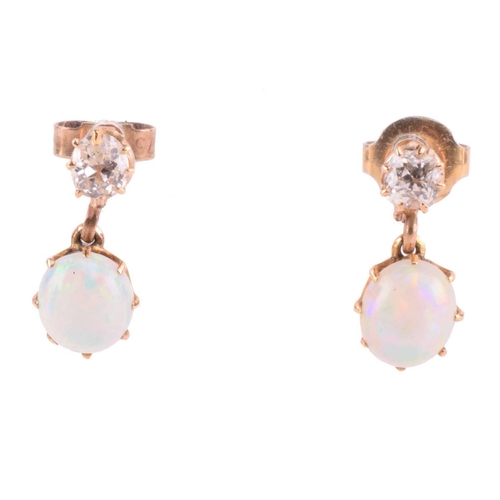 110 - A pair of diamond and opal drop earrings, each comprising an old-cut diamond surmount, approximately... 