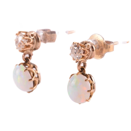 110 - A pair of diamond and opal drop earrings, each comprising an old-cut diamond surmount, approximately... 