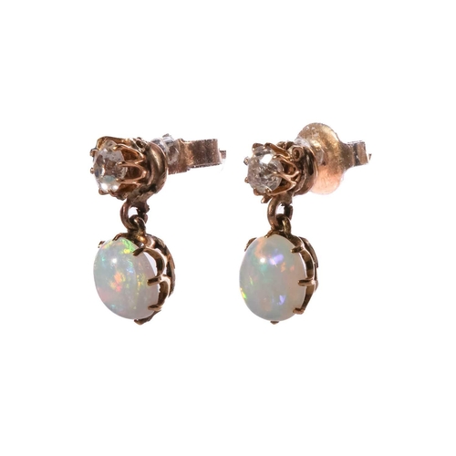 110 - A pair of diamond and opal drop earrings, each comprising an old-cut diamond surmount, approximately... 