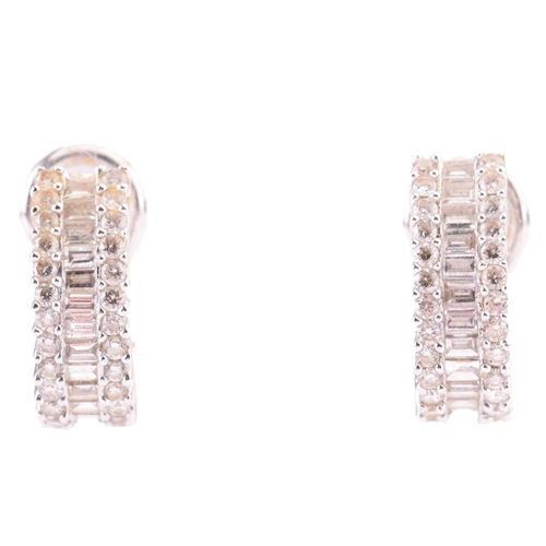 123 - Two pairs of diamond-set earrings; the first pair of hoops each consists of a row of baguette diamon... 