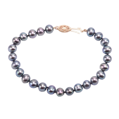 130 - Two gem set rings, a Tahitian pearl necklace and a bracelet. Featuring A sapphire and diamond dress ... 