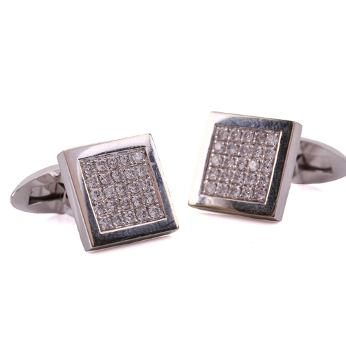 134 - A pair of diamond cufflinks, the square design set with round brilliant cut diamonds with a total es... 