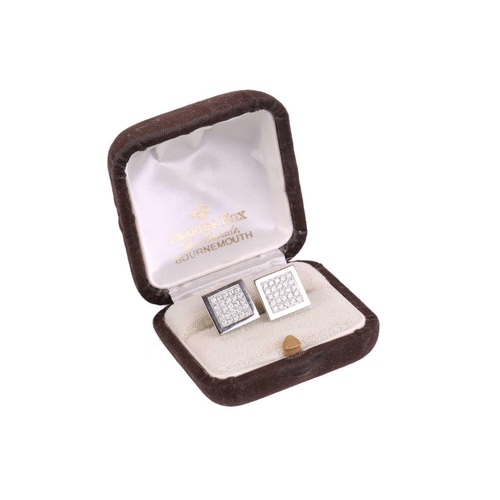 134 - A pair of diamond cufflinks, the square design set with round brilliant cut diamonds with a total es... 