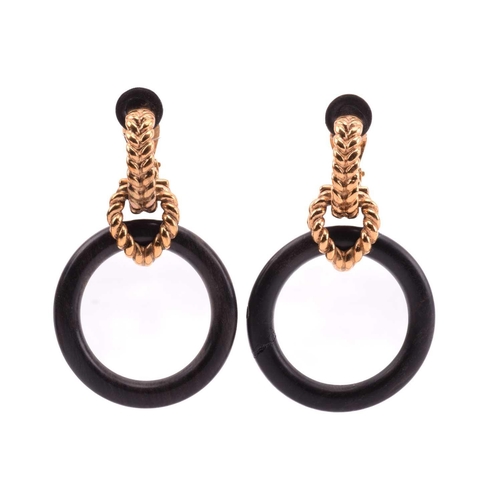 135 - Robert Goossens - two pairs of clip-on hoop earrings set with wood; the first pair of earrings each ... 