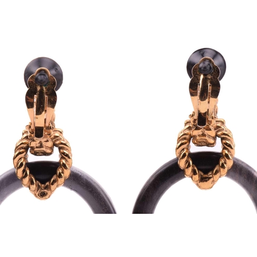 135 - Robert Goossens - two pairs of clip-on hoop earrings set with wood; the first pair of earrings each ... 