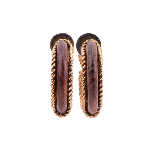 135 - Robert Goossens - two pairs of clip-on hoop earrings set with wood; the first pair of earrings each ... 