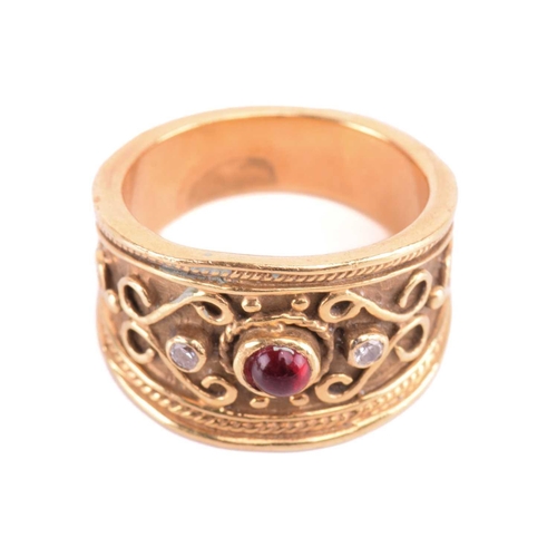 137 - A diamond dress ring, set with a central red paste cabochon between round brilliant cut diamonds, am... 