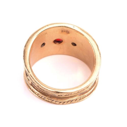 137 - A diamond dress ring, set with a central red paste cabochon between round brilliant cut diamonds, am... 