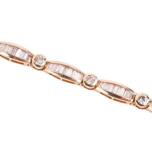 139 - A diamond bracelet, set with round brilliant cut and tapered baguette cut diamonds with a total esti... 