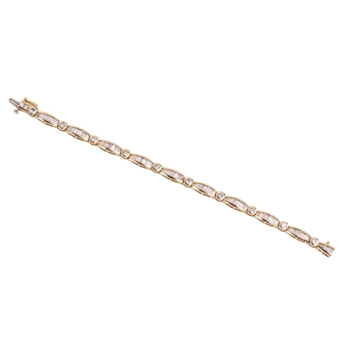 139 - A diamond bracelet, set with round brilliant cut and tapered baguette cut diamonds with a total esti... 