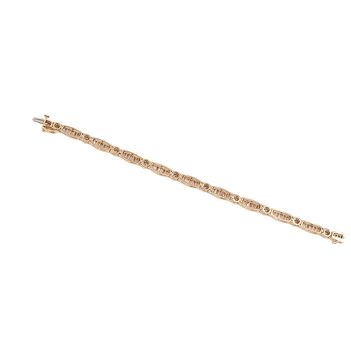 139 - A diamond bracelet, set with round brilliant cut and tapered baguette cut diamonds with a total esti... 