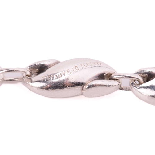 14 - Tiffany & Co. - a seahorse link bracelet by Elsa Peretti, comprising thirteen S-shaped links, secure... 