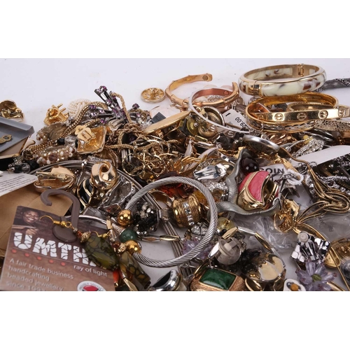 145 - A large quantity of costume jewellery including many pairs of clip-on and stud earrings, various wir... 