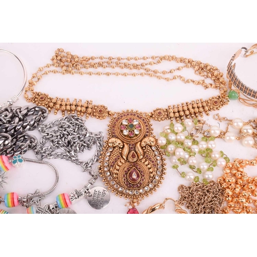 146 - A quantity of base metal costume jewellery including Indian Wedding suites, bangles with some hinged... 